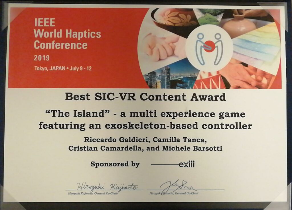 An award certificate from the IEEE World Haptics Conference 2019, held in Tokyo, Japan, from July 9 to 12. The certificate is for the 'Best SIC-VR Content Award' and is awarded to 'The Island' - a multi-experience game featuring an exoskeleton-based controller. The recipients of the award are Riccardo Galdieri, Camilla Tanca, Cristian Camardella, and Michele Barsotti. The award is sponsored by exiii and signed by Hiroyuki Kajimoto, General Co-Chair.